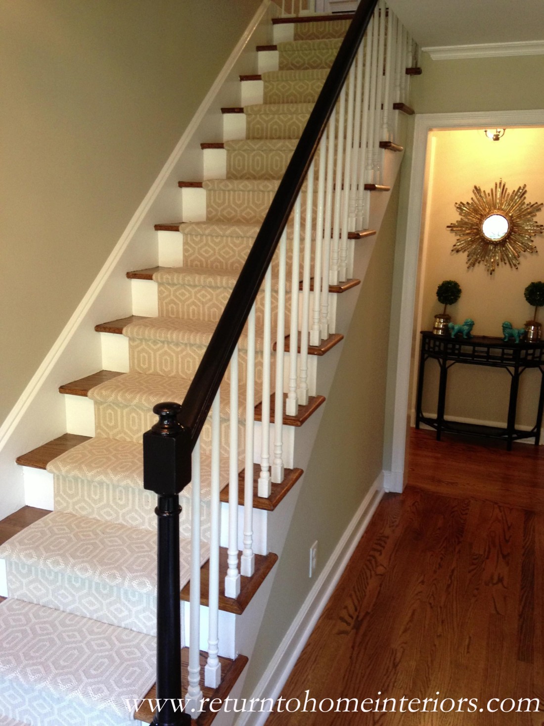 Stair case in house showing a stair runner