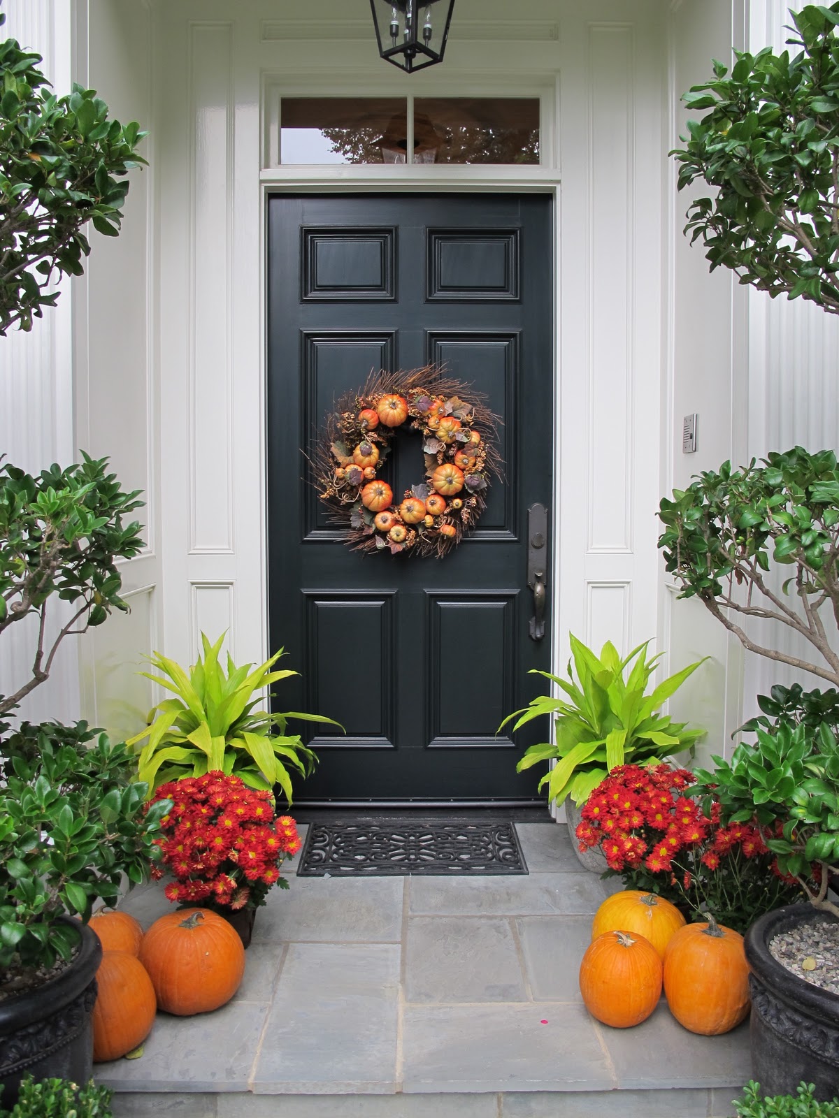 oversized-plant-pots-and-cute-orange-pumpkin-for-fall-decoration-idea-also-modern-wreath-for-front-door